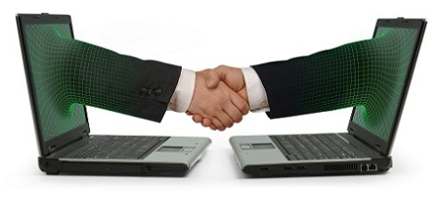 Two facing laptops with an arm emerging from each screen and shaking hands on a white background